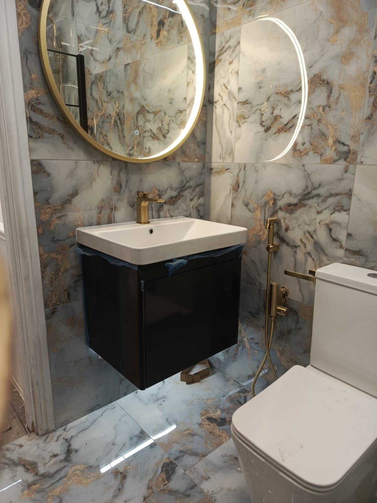 Bathroom with two backlit LED mirrors installed by Z Electricals